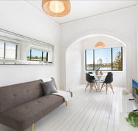 Minimalist Beachfront Apartment - Tourism Cairns