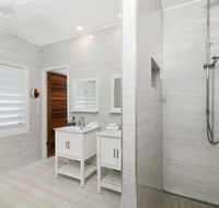 Bathers across the bay from Port Douglas - Tourism Cairns