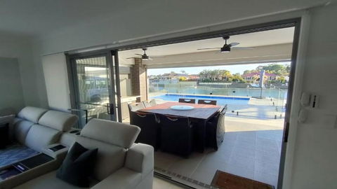 Relax Poolside By The Canal - Tourism Cairns 0